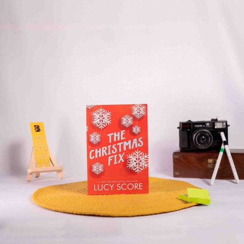 Buy The Christmas Fix Online By Lucy Score the romantic fiction book by BookBins.in