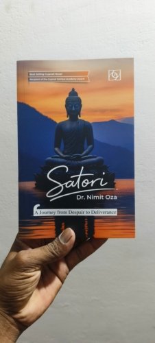 Book cover showing a blue Buddha statue meditating at sunset over water, title 'Satori' by Dr. Nimit Oza, subtitle 'A Journey from Despair to Deliverance'.